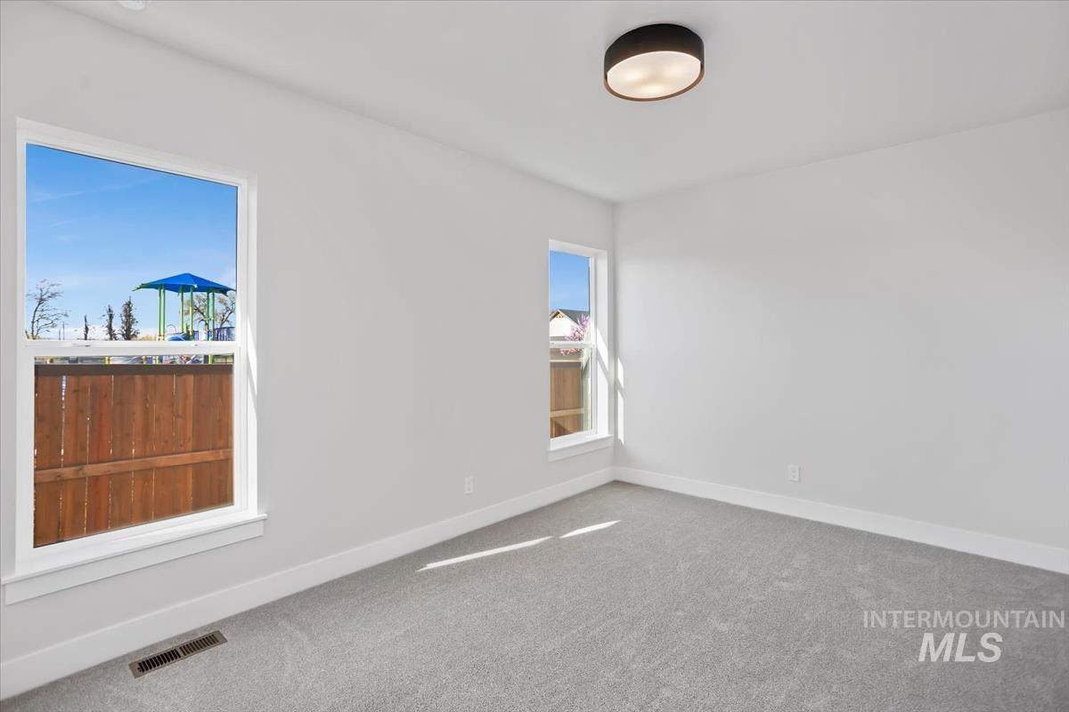 232 South Fusion Avenue Kuna, ID 83634 - Photo 38 of 50 Empty room with carpet floors