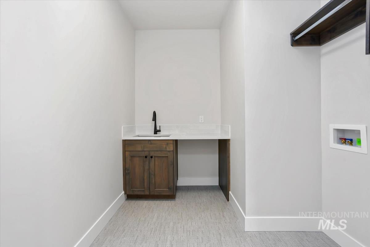 232 South Fusion Avenue Kuna, ID 83634 - Photo 41 of 50 Laundry room featuring baseboards and washer hookup