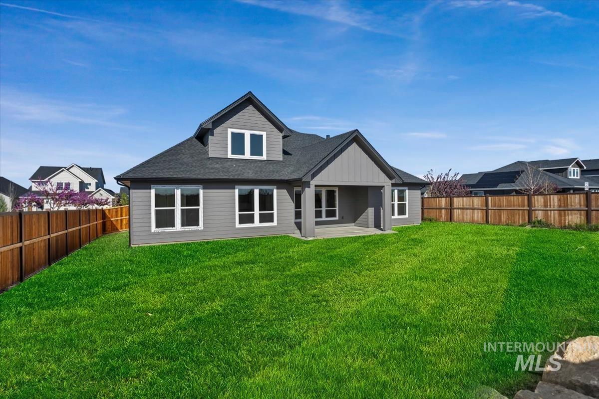 232 South Fusion Avenue Kuna, ID 83634 - Photo 44 of 50 Back of property featuring a patio area, a shingled roof, and a fenced backyard