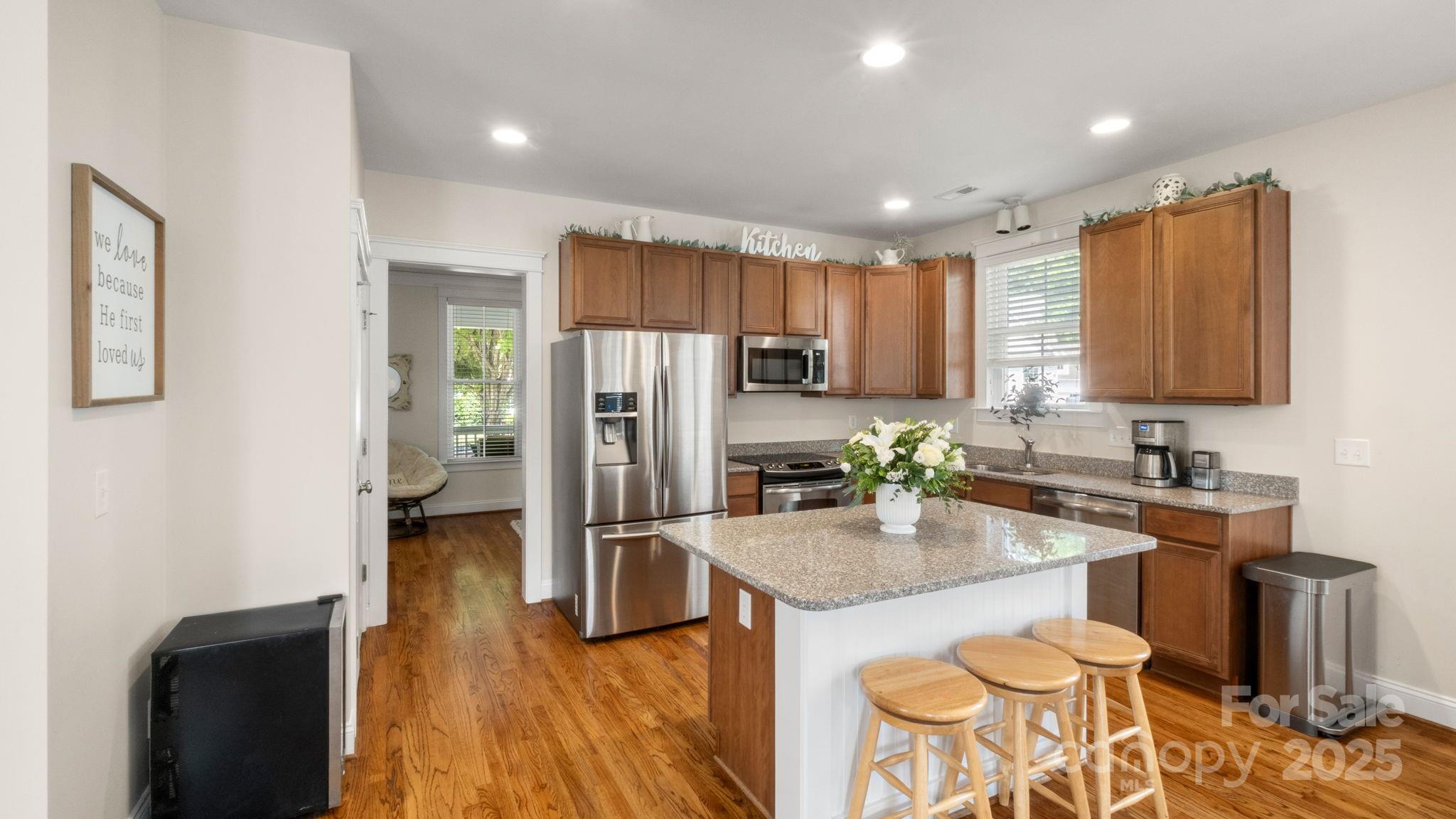 3499 Richard's Crossing Fort Mill, SC 29708 - Photo 11 of 33 a kitchen with granite countertop a refrigerator stove microwave and sink