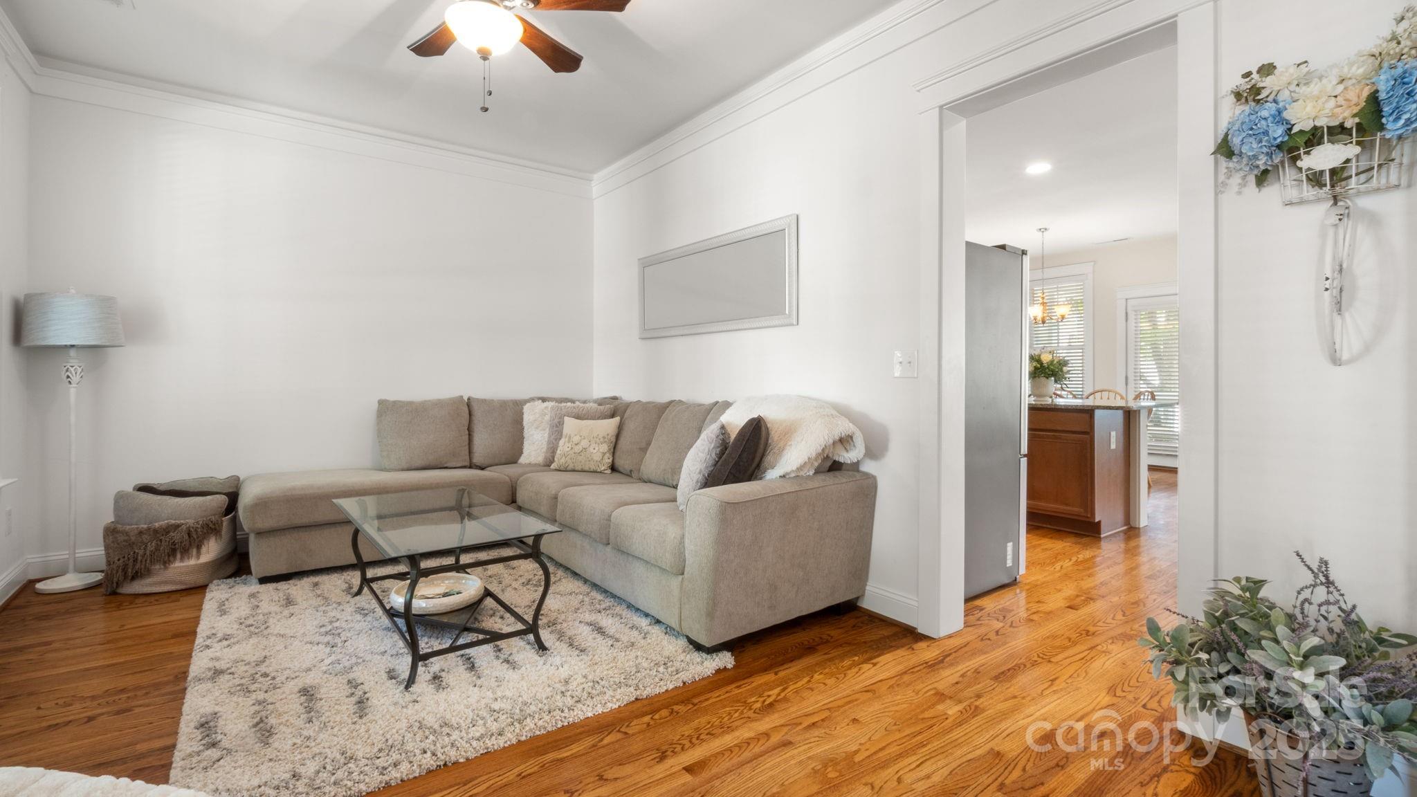 3499 Richard's Crossing Fort Mill, SC 29708 - Photo 7 of 33 a living room with furniture and a chandelier
