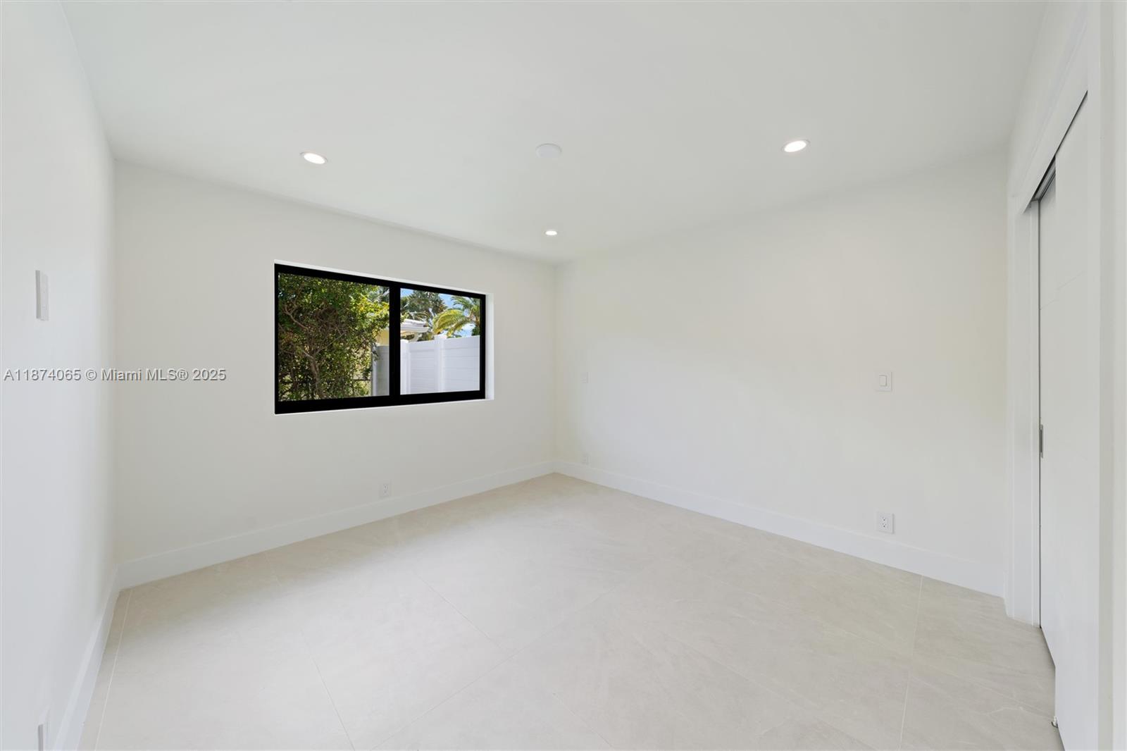 3041 Northeast 45th Street Lighthouse Point, FL 33064 - Photo 16 of 20 a view of an empty room with a window