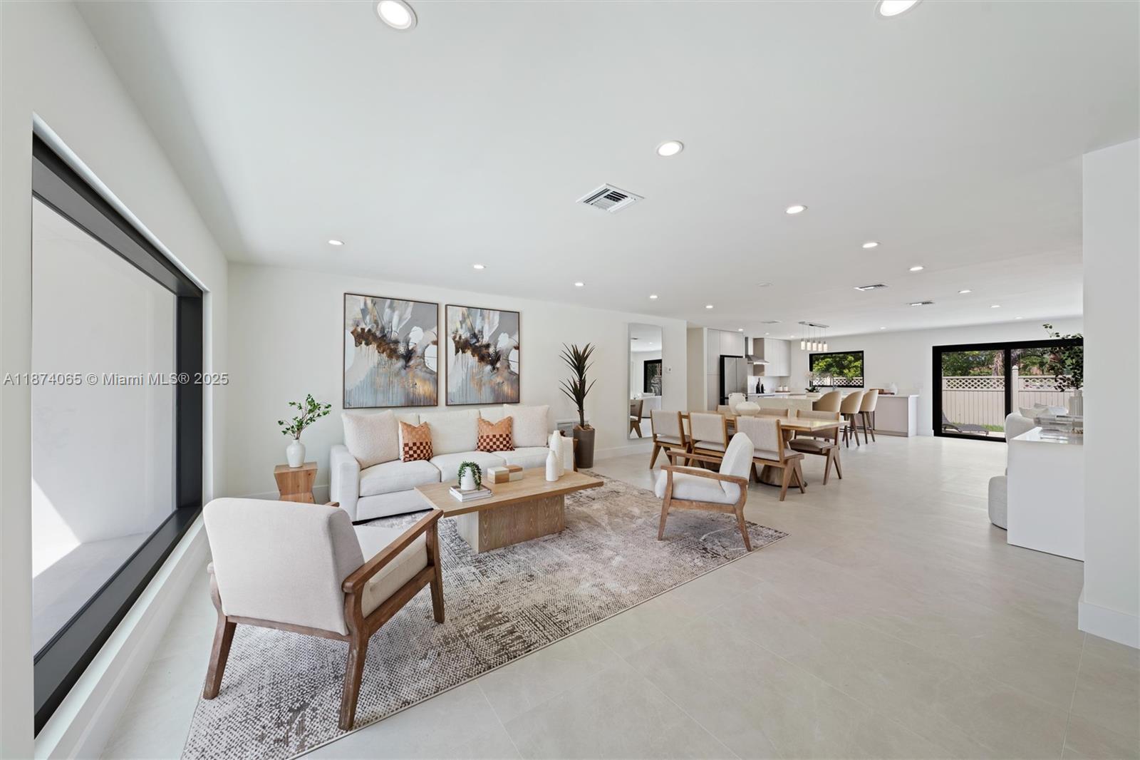 3041 Northeast 45th Street Lighthouse Point, FL 33064 - Photo 3 of 20 a living room with furniture and a large window