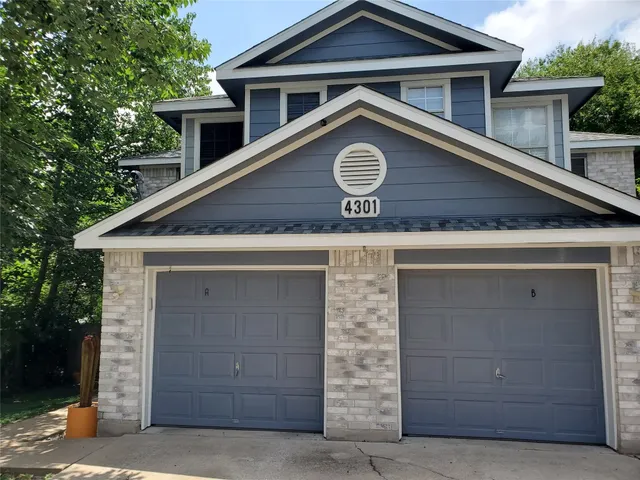 a front view of a house with a fence