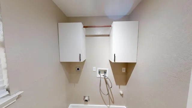a kitchen with wooden floor and stainless steel appliances
