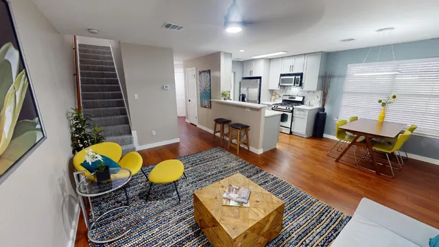 a view of a livingroom with furniture and wooden floor