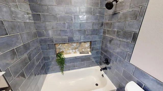 a bathroom with a glass door shower