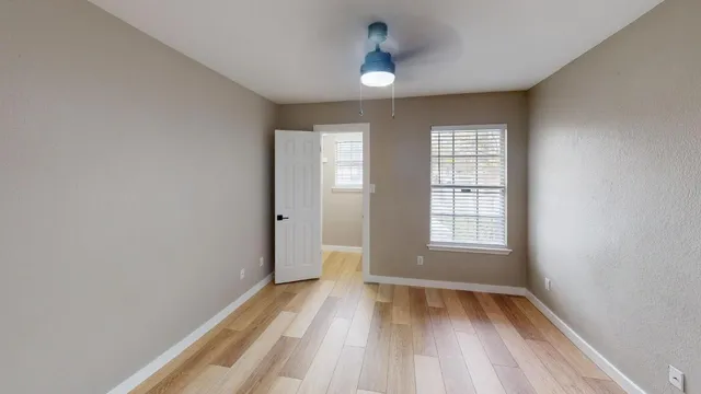 a view of wooden floor in an empty room