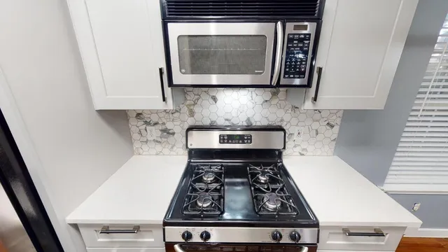 a view of a backyard with large trees