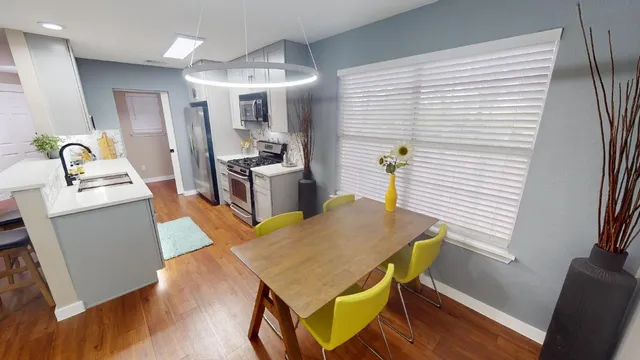 a kitchen with a table and chairs