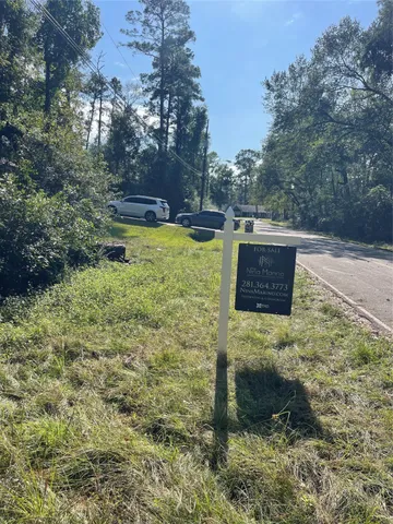 a view of swimming pool with seating area