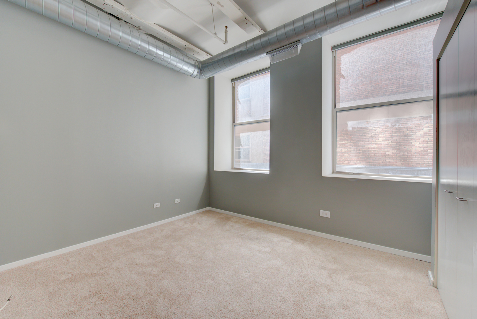 500 South Clinton Street, Unit 230 Chicago, IL 60607 - Photo 15 of 31 a view of an empty room with a window