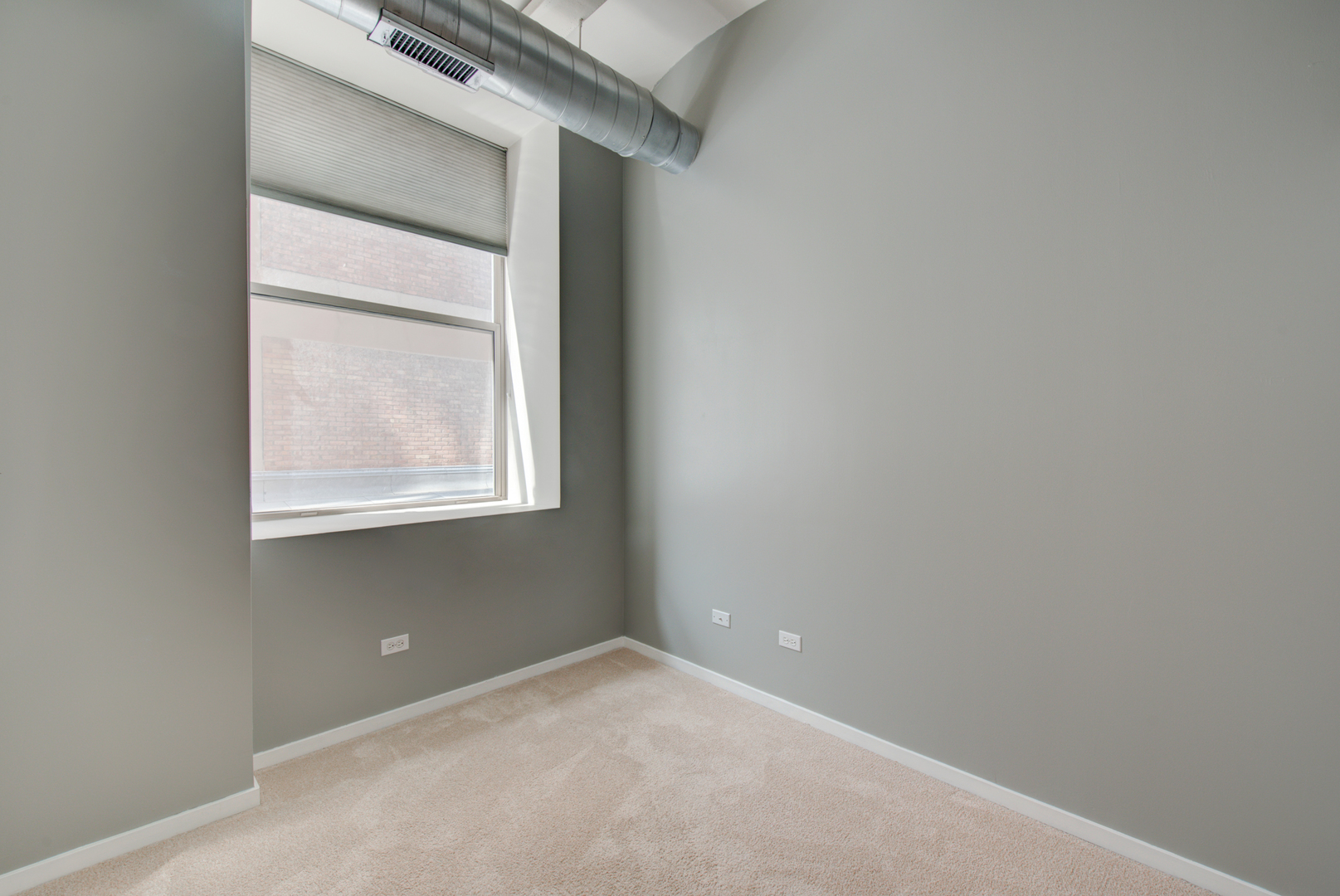 500 South Clinton Street, Unit 230 Chicago, IL 60607 - Photo 18 of 31 a view of an empty room with a window