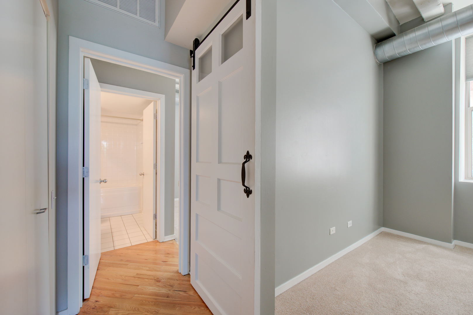 500 South Clinton Street, Unit 230 Chicago, IL 60607 - Photo 19 of 31 a view of a bathroom from a hallway