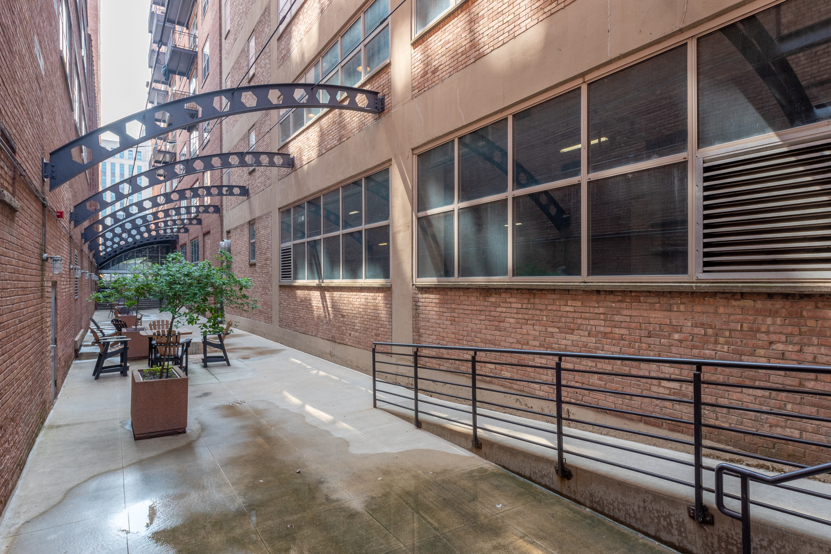 500 South Clinton Street, Unit 230 Chicago, IL 60607 - Photo 26 of 31 a view of a house with outdoor seating and a potted plant