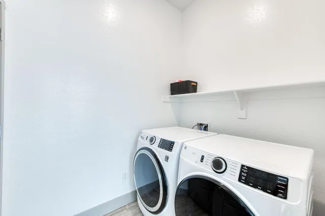 a utility room with dryer and washer