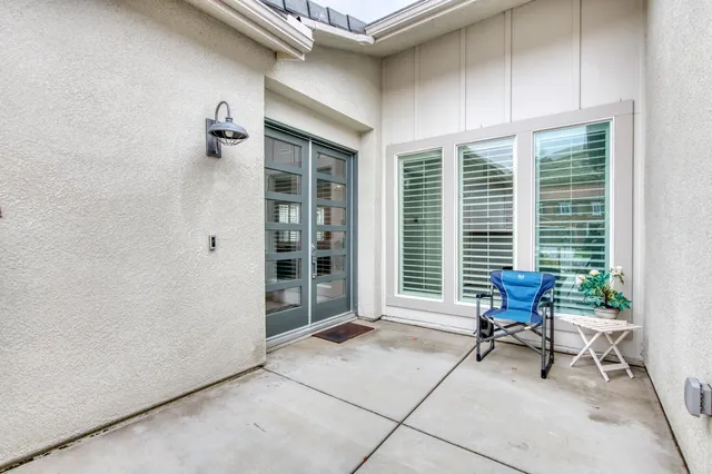 a view of a livingroom with chair and table
