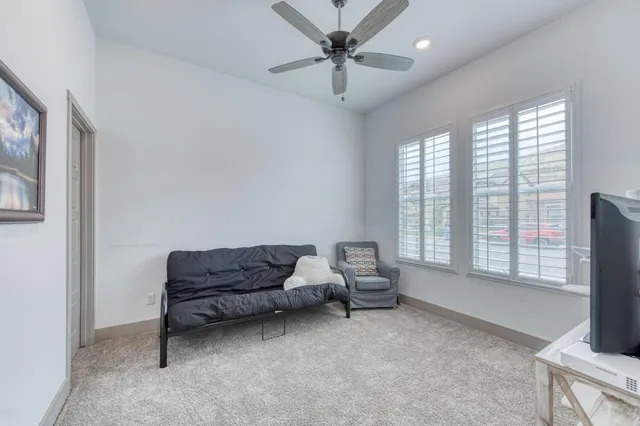 a living room with furniture and a window