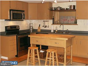 145 Big Oak Road Bridgeton, NJ 08302 - Photo 7 of 12 a kitchen with a sink and a stove
