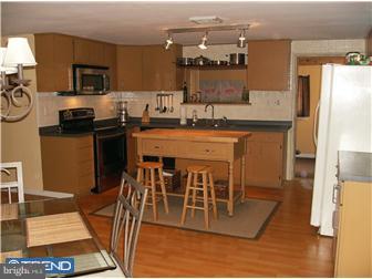 145 Big Oak Road Bridgeton, NJ 08302 - Photo 8 of 12 a kitchen with stainless steel appliances granite countertop a stove top oven a sink and a refrigerator