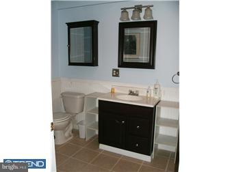 145 Big Oak Road Bridgeton, NJ 08302 - Photo 10 of 12 a bathroom with a toilet sink and mirror