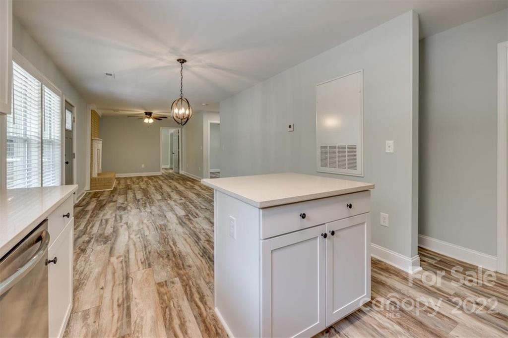 6973 Narrow Lane Road Hickory Grove, SC 29717 - Photo 14 of 35 a view of a kitchen with a sink and wooden floor