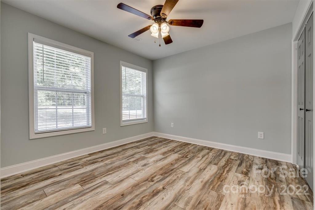 6973 Narrow Lane Road Hickory Grove, SC 29717 - Photo 17 of 35 a view of empty room with wooden floor and fan