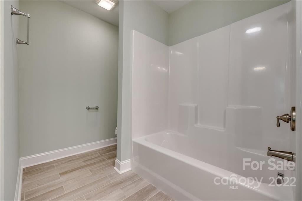 6973 Narrow Lane Road Hickory Grove, SC 29717 - Photo 20 of 35 a bathroom with a bathtub and shower