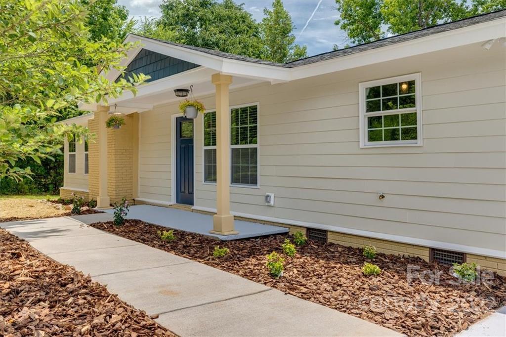 6973 Narrow Lane Road Hickory Grove, SC 29717 - Photo 2 of 35 a front view of a house with garden