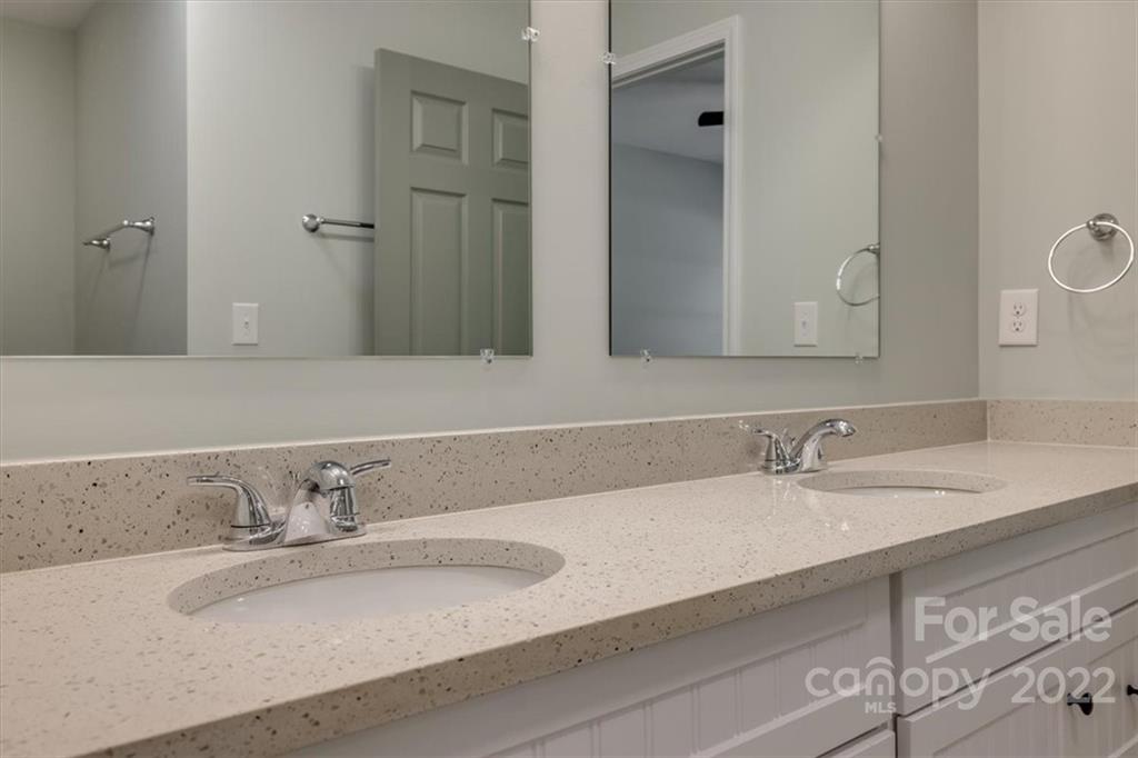 6973 Narrow Lane Road Hickory Grove, SC 29717 - Photo 21 of 35 a bathroom with double vanity sinks and a mirror