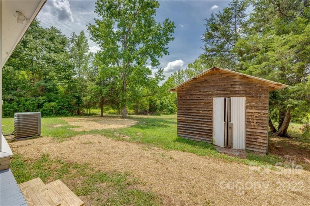 6973 Narrow Lane Road Hickory Grove, SC 29717 - Photo 27 of 35 a front view of a house with a yard