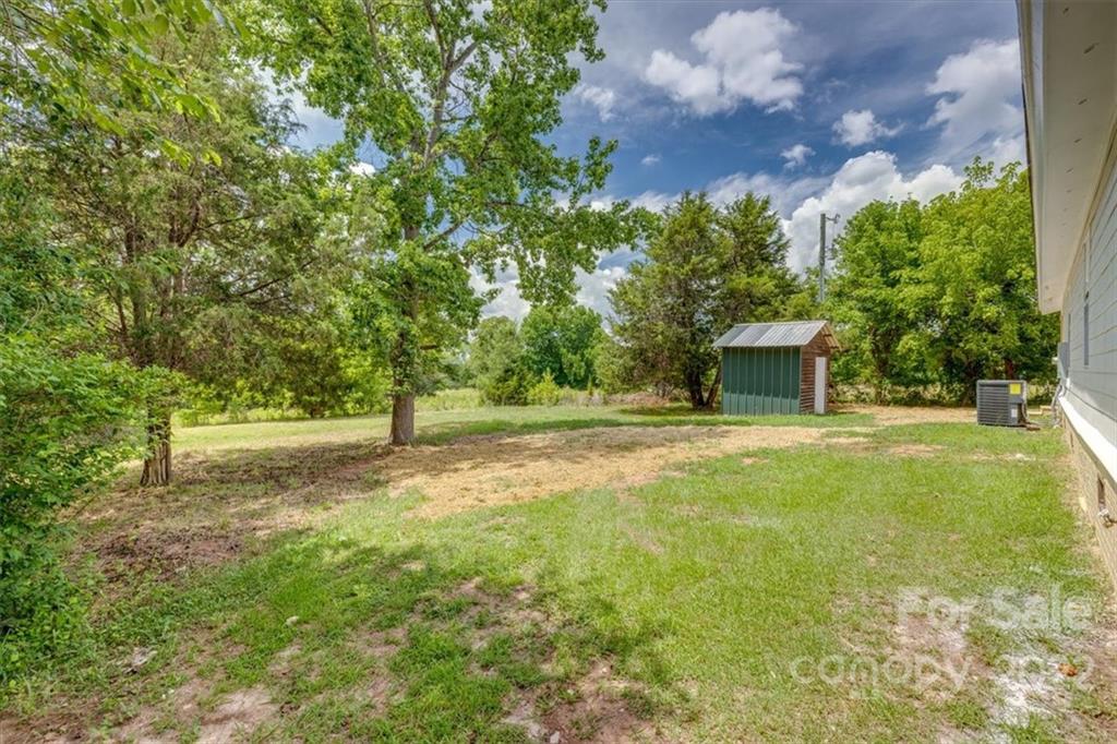 6973 Narrow Lane Road Hickory Grove, SC 29717 - Photo 28 of 35 a backyard of a house with table and chairs