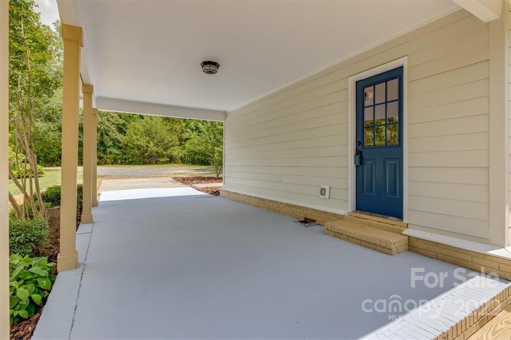 6973 Narrow Lane Road Hickory Grove, SC 29717 - Photo 31 of 35 a view of an empty room with a window and brick walls