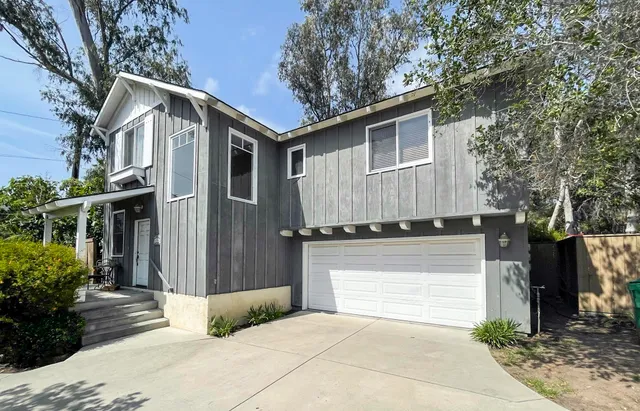 an aerial view of residential houses and outdoor space