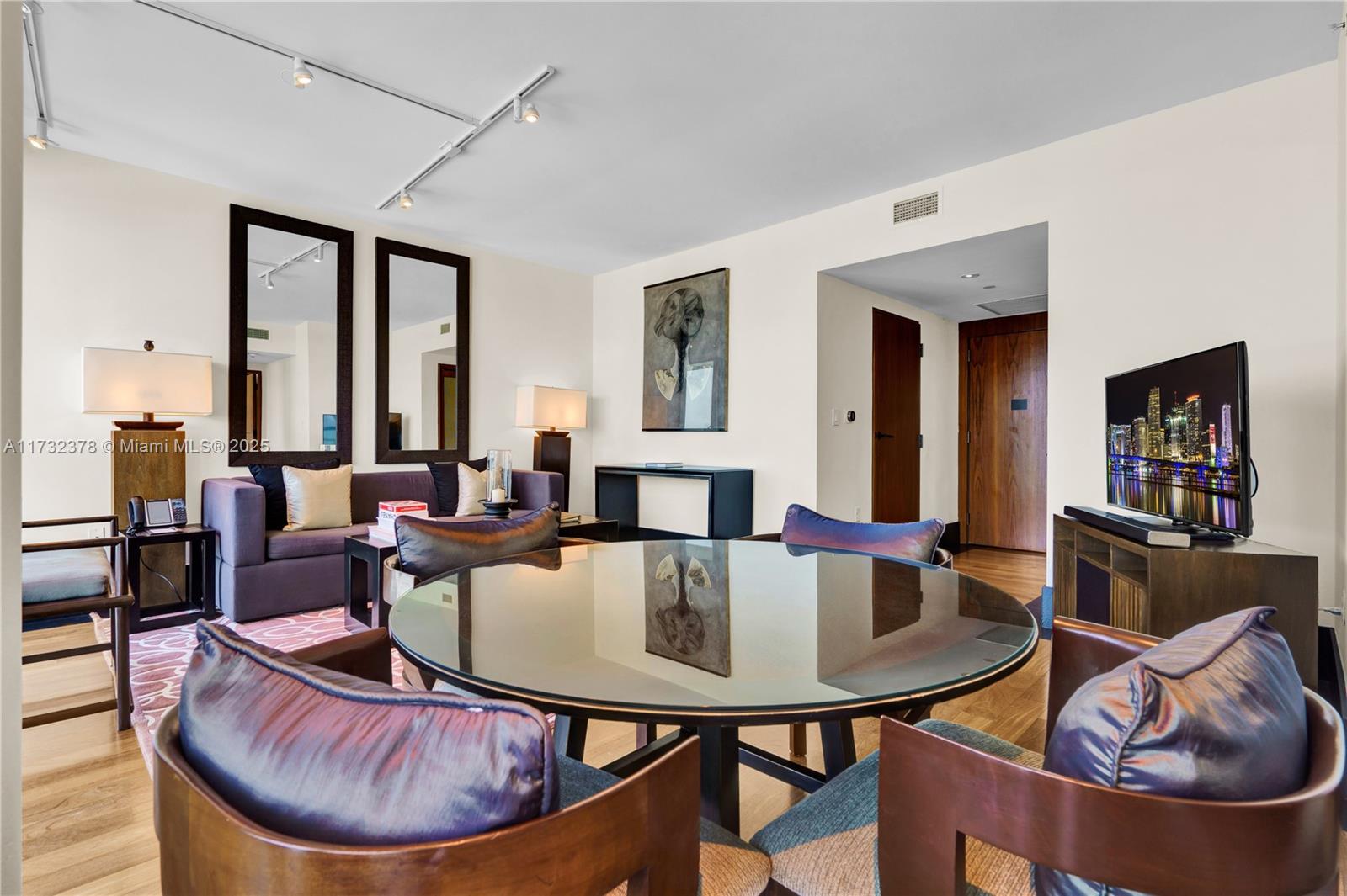 101 20th Street, Unit 1805 Miami Beach, FL 33139 - Photo 11 of 50 a living room with furniture and a potted plant