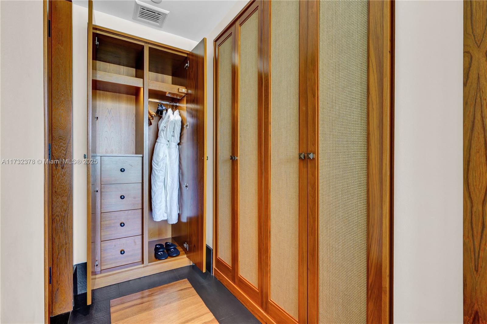 101 20th Street, Unit 1805 Miami Beach, FL 33139 - Photo 25 of 50 a view of walk in closet with clothes and shoes