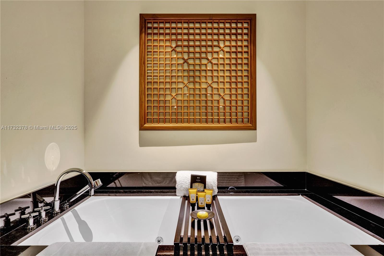 101 20th Street, Unit 1805 Miami Beach, FL 33139 - Photo 28 of 50 a bathroom with a bathtub and a sink