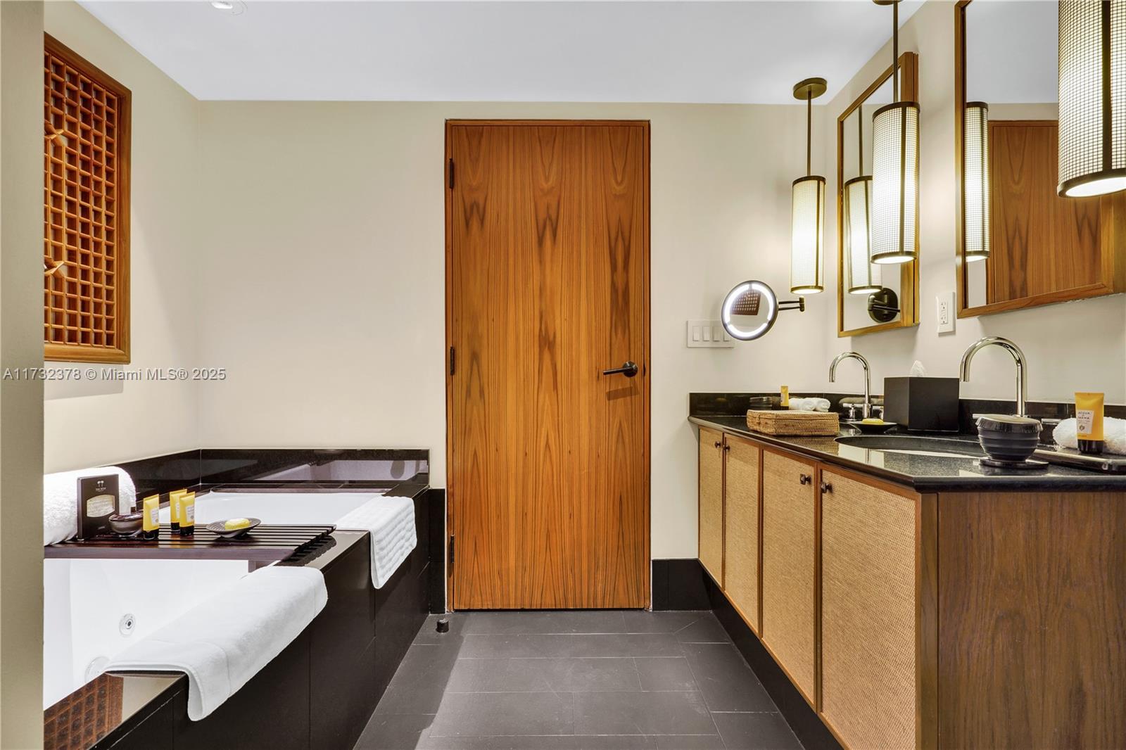 101 20th Street, Unit 1805 Miami Beach, FL 33139 - Photo 32 of 50 a bathroom with a sink and a mirror