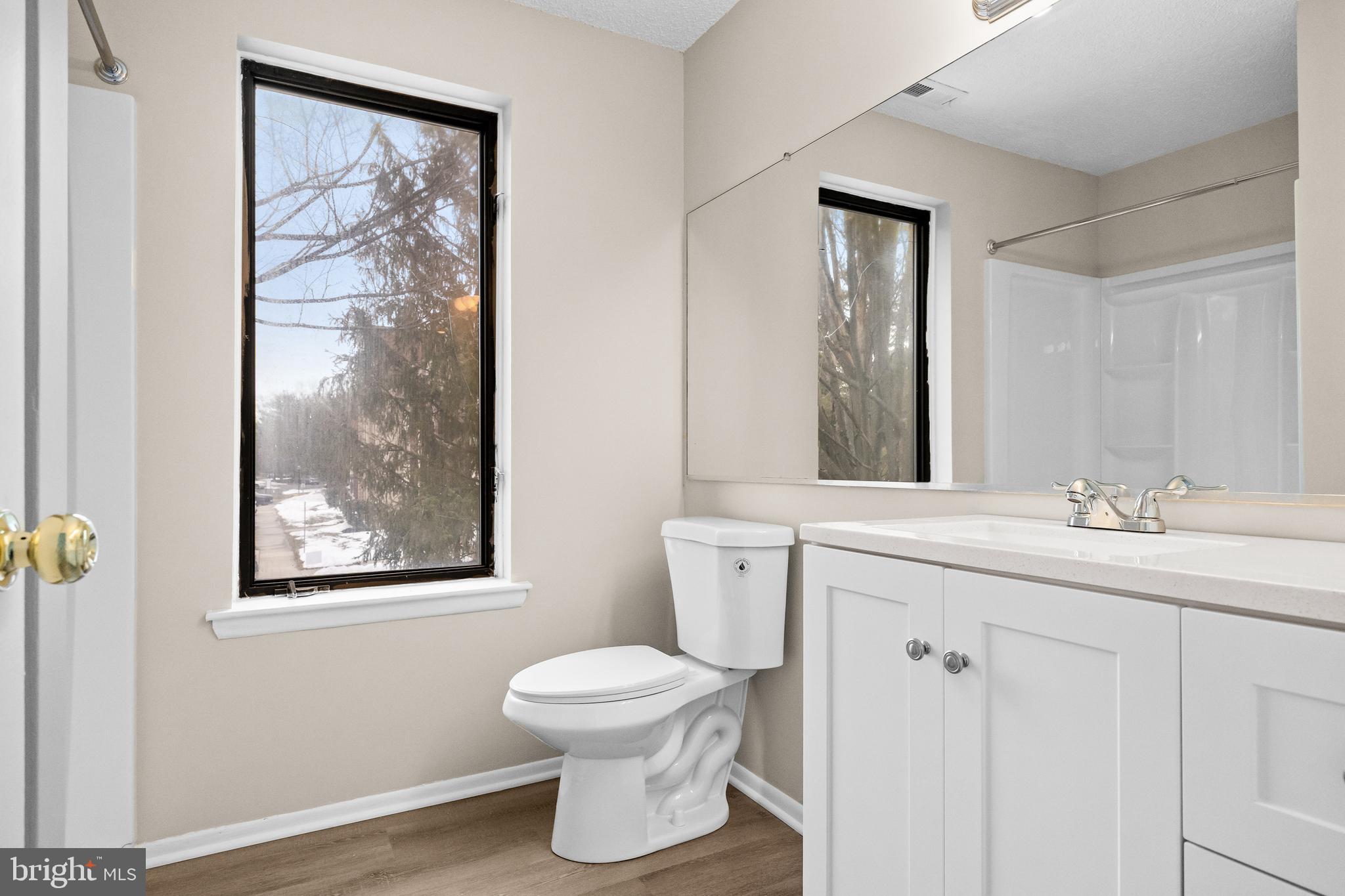 4904B Dunbarton Road Mount Laurel, NJ 08054 - Photo 15 of 27 a bathroom with a toilet sink and mirror