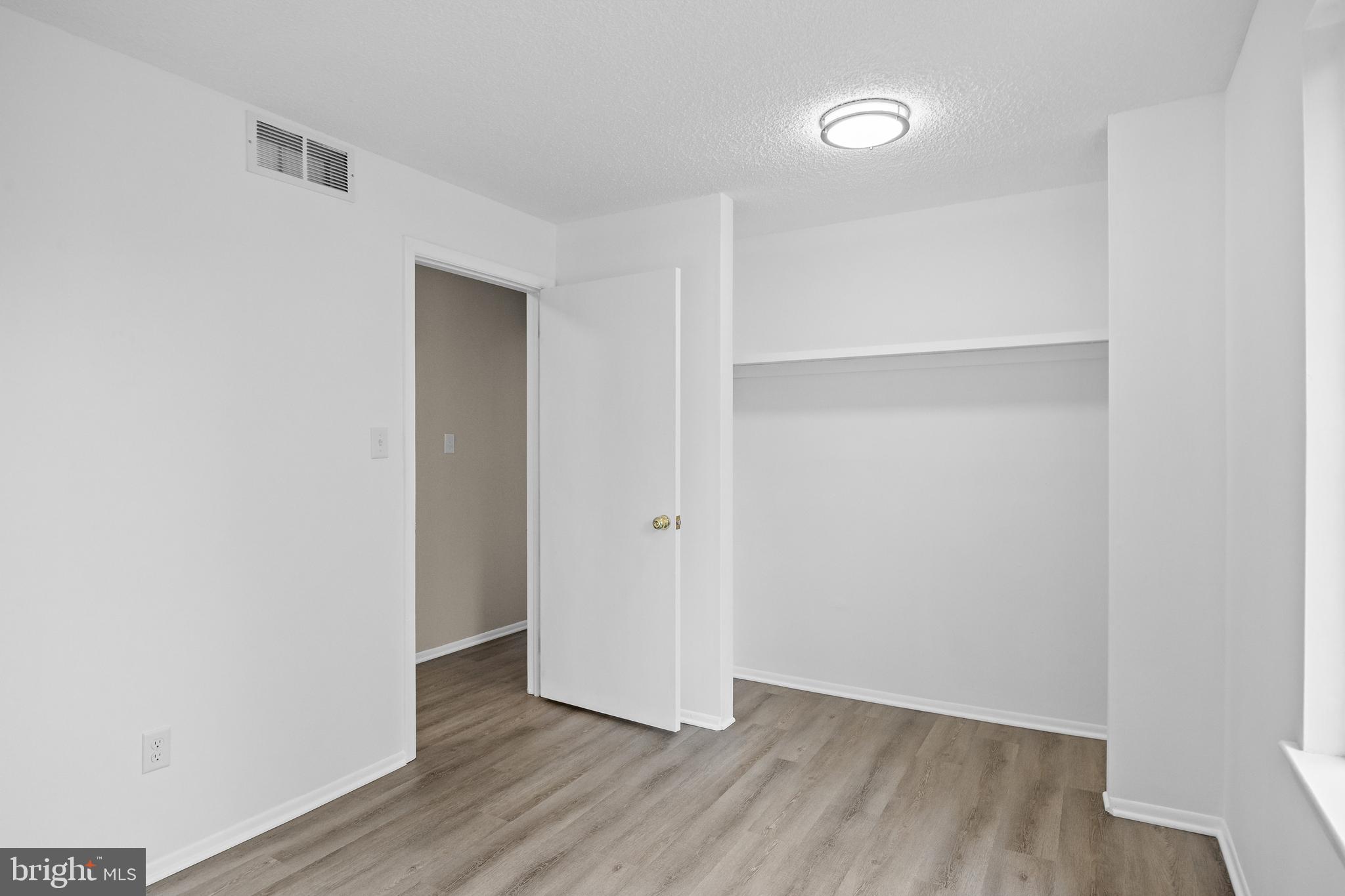 4904B Dunbarton Road Mount Laurel, NJ 08054 - Photo 18 of 27 a view of an empty room with wooden floor