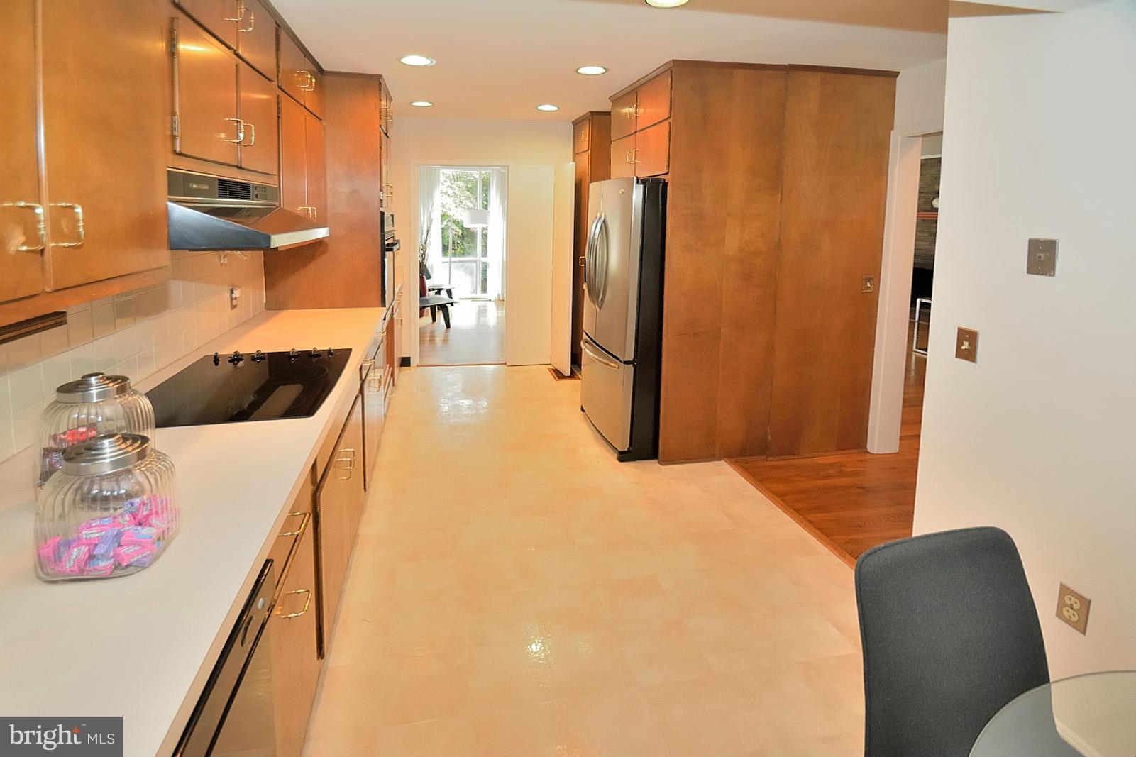 1925 Marthas Road Alexandria, VA 22307 - Photo 14 of 29 a kitchen with stainless steel appliances a refrigerator and a wooden floor