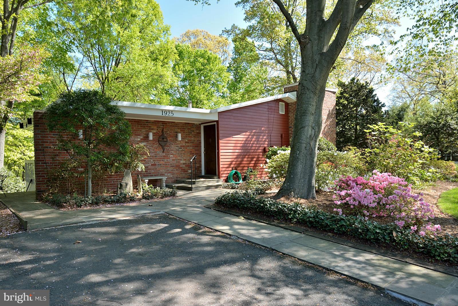 1925 Marthas Road Alexandria, VA 22307 - Photo 24 of 29 a front view of a house with garden