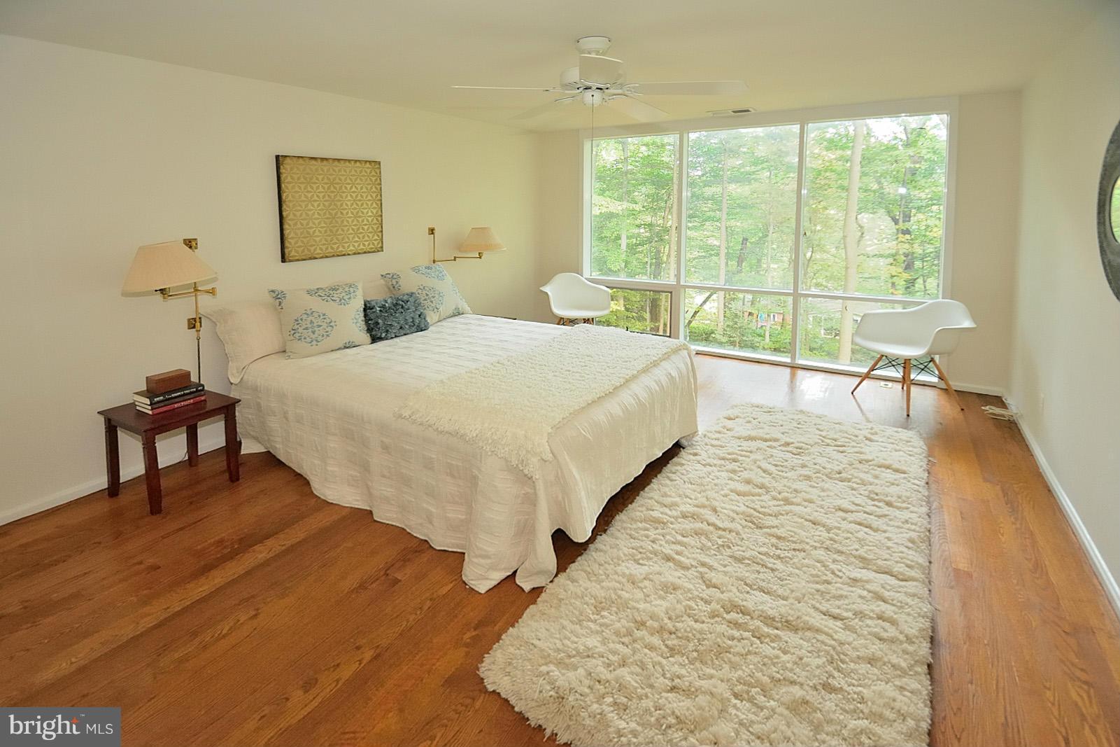 1925 Marthas Road Alexandria, VA 22307 - Photo 5 of 29 a spacious bedroom with a bed and a large window