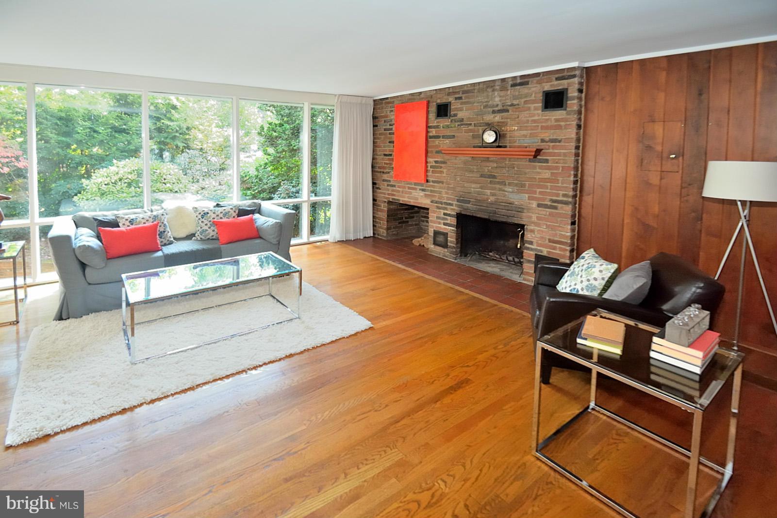 1925 Marthas Road Alexandria, VA 22307 - Photo 8 of 29 a living room with furniture a fireplace and a table
