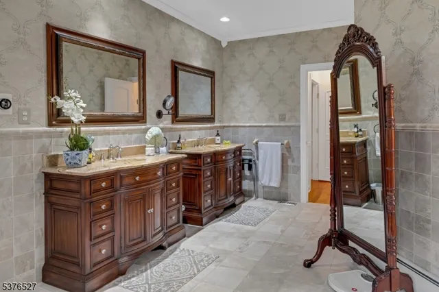 a bathroom with a double vanity sink and a mirror