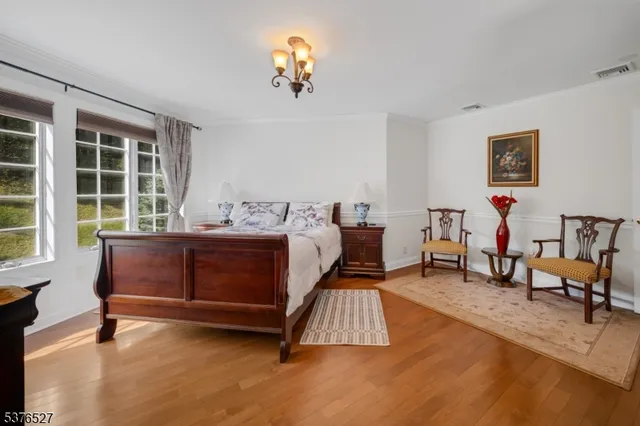 a bedroom with furniture and a window