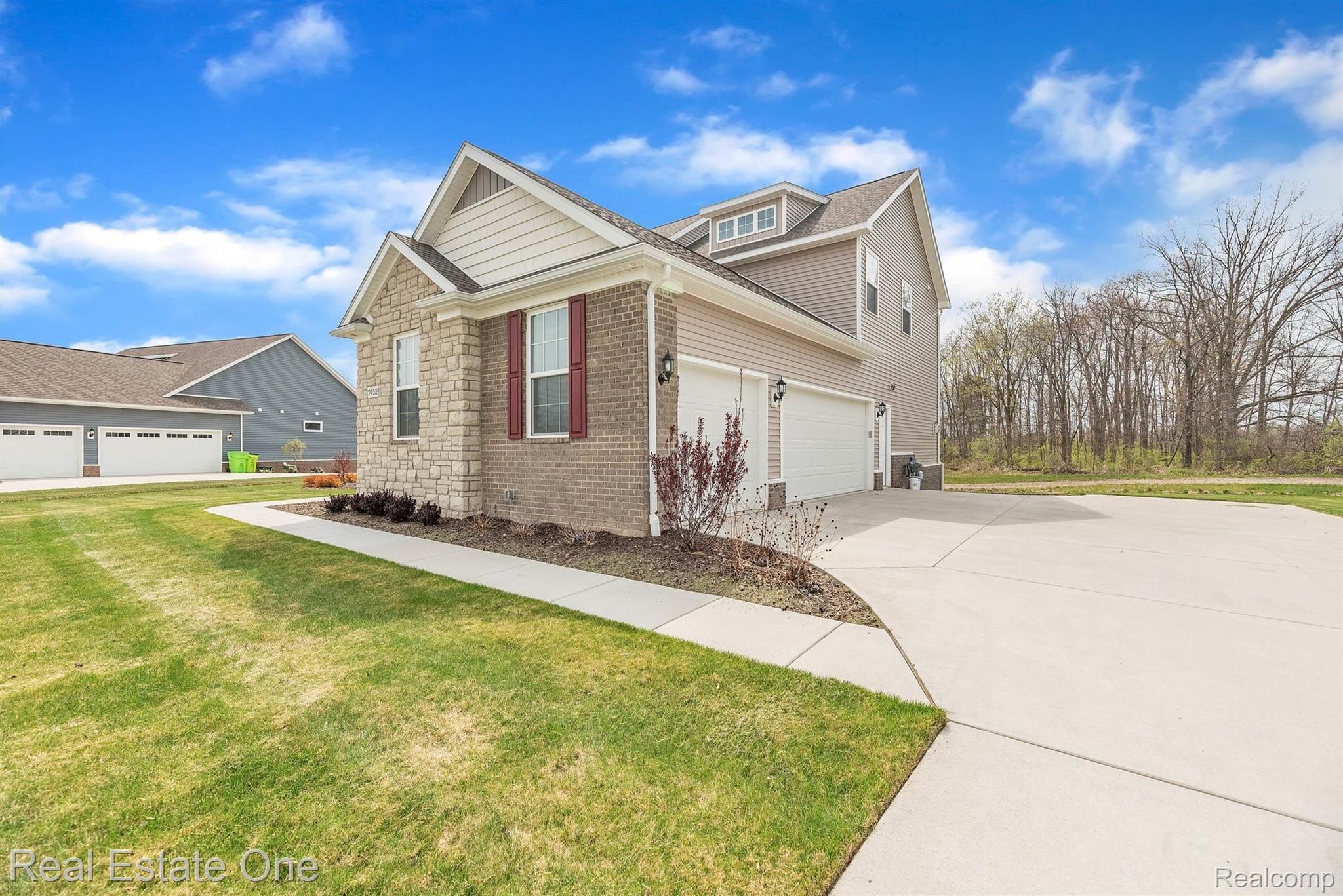 2452 Walnut View Drive Howell, MI 48855 - Photo 3 of 39 07-2452 Walnut View Dr-WindowStill-Real-Estate-Photography-7.jpg