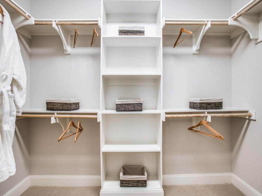 4719 Cole Avenue, Unit 266 Dallas, TX 75205 - Photo 15 of 35 a view of walk in closet with glass door and cabinet