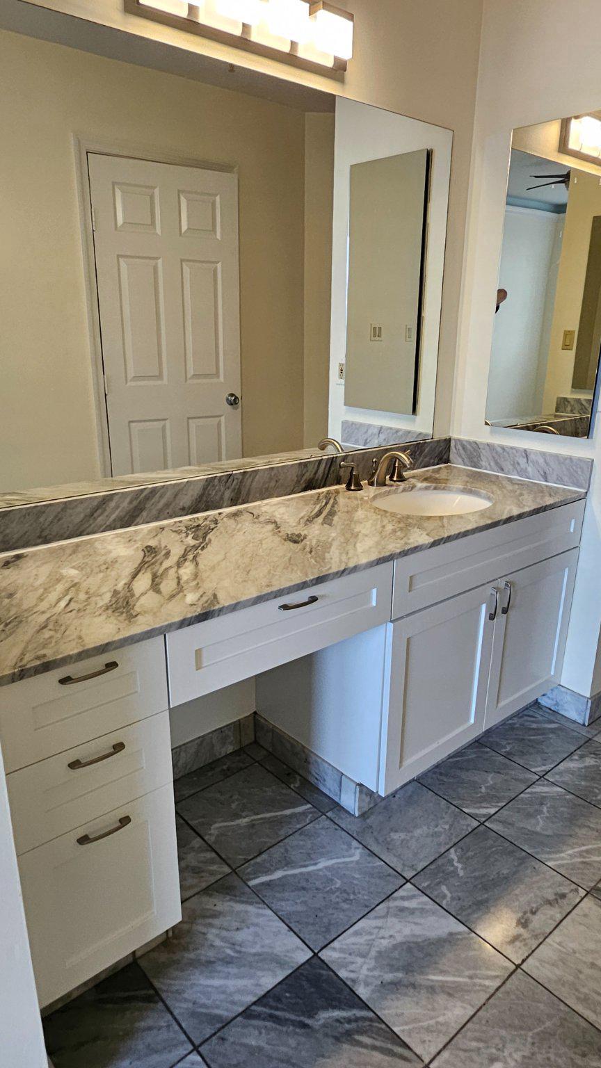 3801 Canterbury Road, Unit 703 Baltimore, MD 21218 - Photo 13 of 32 Marble Vanity Primary Bedroom