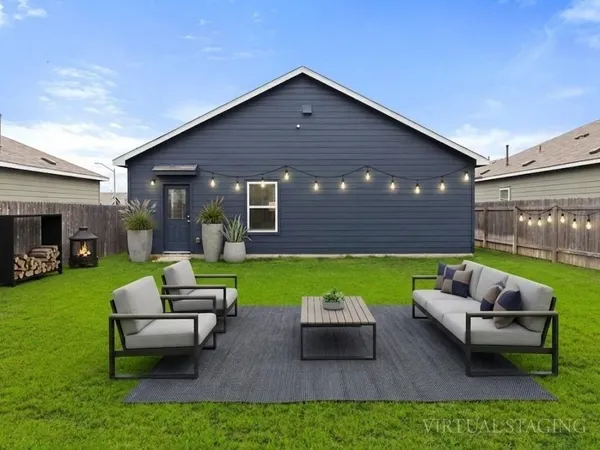 a view of a house with a couches in a patio